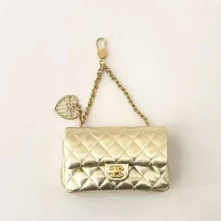CC CLASSIC FLAP BAG 13 IN GOLD LAMBSKIN WITH PEARL HEART CHARM
