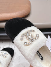 CHANEL 26S MULES IN BLACK AND WHITE SHEARLING WITH ROUND TOE