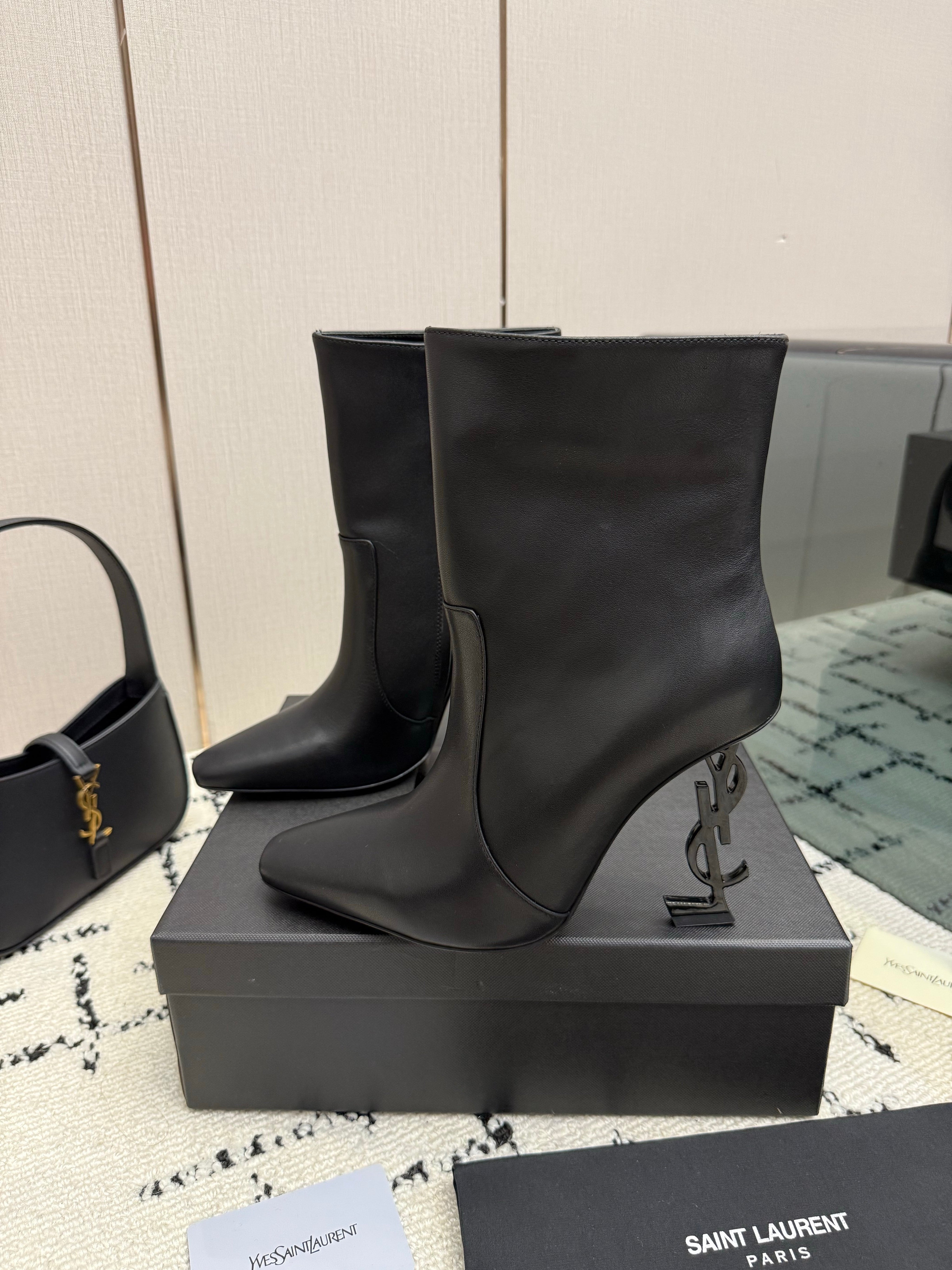 YSL 26S YSL LOGO HEEL ANKLE BOOTS 100 MM IN BLACK CALFSKIN