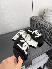 CHANEL 26S SLIDE SANDALS IN BLACK SHEARLING AND WHITE CC LOGO SQUARE TOE
