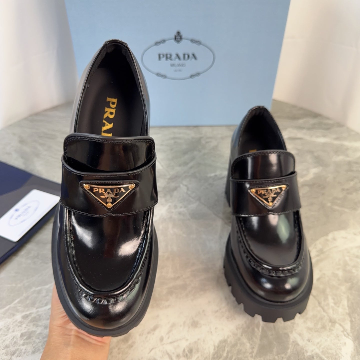 PRADA 26S HEELED LOAFERS 85 MM IN BLACK CALFSKIN
